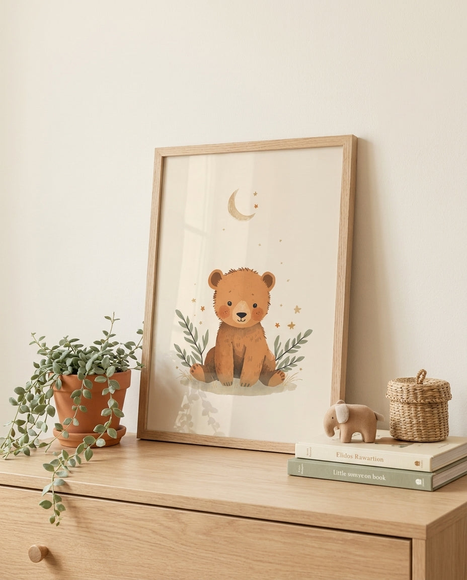 Boho bear nursery print framed and leaning on a wooden dresser with plant and toys